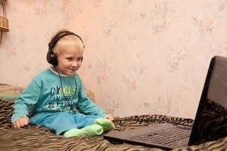Boy in headphones with notebook