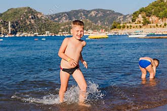 Boy runs out of the sea in Turkey