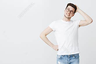 Guy feeling confused picking gift in cosmetics shop scratching back of head clueless making tight awkward and unsure