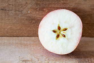Cut Apple on a Wooden Plank