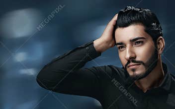 Men Hair Care. Handsome Man With Beard Touching Healthy Hair