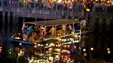 Monks drop lanterns on river for peace all people in night