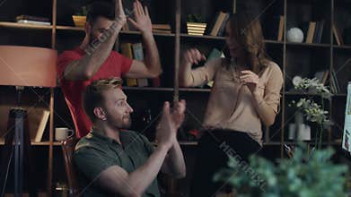 Happy business team enjoy profitable sale. Startup team giving high five