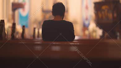 Christian man praying to GOD in church