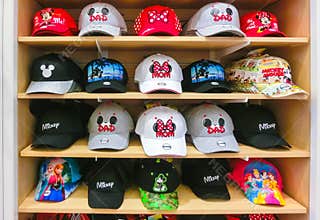 Orlando, USA - May 10, 2018: The colorful baseball caps at Disney store indoor shopping mall Orlando premium outlet at