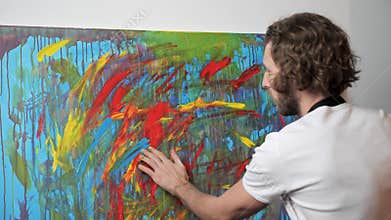 Colorful, Emotional Painter Creating Modern Abstract Piece of Fine Art.
