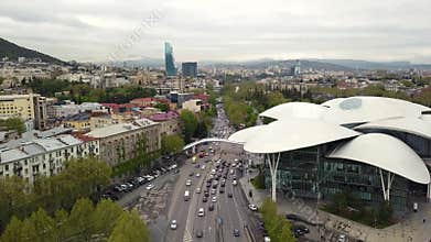 Tbilisi City Hall Aerial. Cars Traffic in the city with modern buildings.