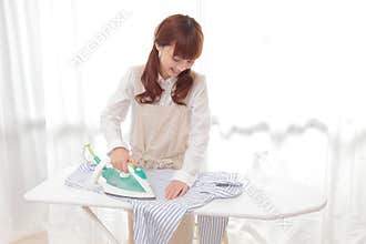 Young Asian women to the ironing