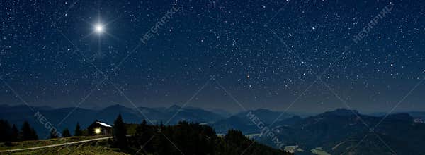 moon shines over the manger of christmas of Jesus Christ