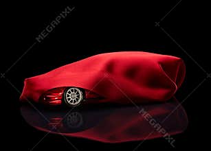 New car hidden under red cover