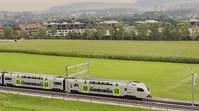 BLS RABe 515 026 â€“ Double-decker train â€œMUTZâ€ from Bern to Belp seen from Gurten Hill. Bern