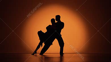 Couple of dancers approach each other and begin to dance Argentine tango. Elements of latin ballroom dance in studio