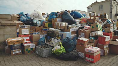 Lviv, Ukraine - March 15, 2022: Volunteers putting donations for Ukrainian refugees and packing them for transport to