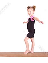 Young Gymnast balances on beam