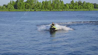 One man rides a water scooter along the Dnieper River in Kherson. Video 7 seconds