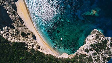 Paradise beach, chomi, Corfu in Greece. Drone shot of a turquoise coloured sea.