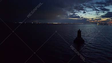 Aerial view of the lighthouse in the Black Sea under the night sky near the town of Pomorie in Bulgaria