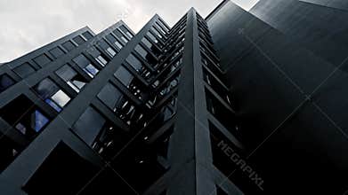 Blue skyscraper facade. office buildings. modern glass silhouettes.
