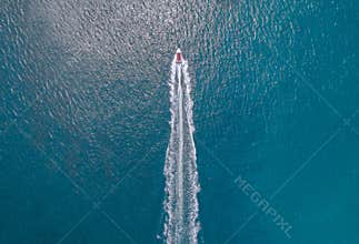Boats and speedboats on the surface of the sea