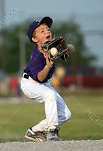 Boy catching baseball