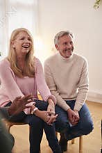 Mature Couple Attending Support Group Meeting For Mental Health Or Dependency Issues