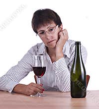 Woman in business shirt drinking red wine alone