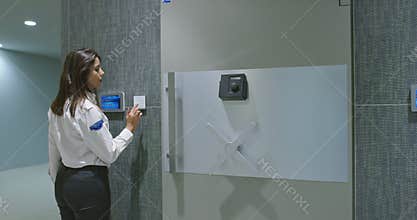 Security opening a wheel of large vault metal door with various access control devices, security concept, money in safe