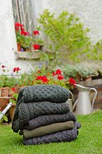 Men's Aran knit traditional jumpers outdoors