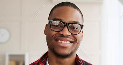 Smiling young man wearing eyeglasses