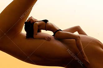 Beautiful Woman on Man's Biceps