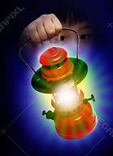 Boy holding oil lamp