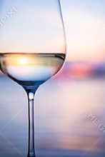 Art white wine on the sky background