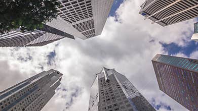 Looking up perspective of modern business skyscrapers glass and sky view landscape of commercial building in central