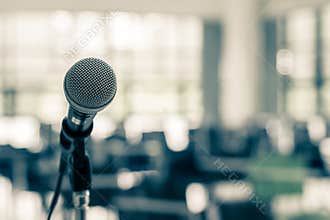 Microphone voice speaker in business seminar, speech presentation, town hall meeting, lecture hall or conference room