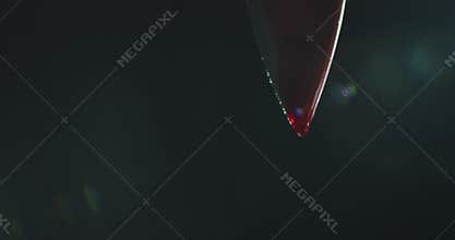 Blood Dripping from Tip of Knife. High quality