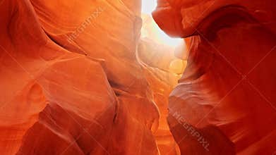 Dust flies in the sun in antelope canyon. Zoom out