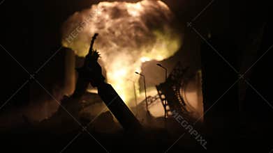 Nuclear war concept. Explosion of nuclear bomb. Creative artwork decoration in dark. Silhouette of soldier standing against giant