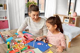 daughter with mother making applique at home