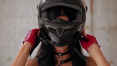 brunette posing in motorbike helmet