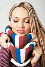 Cute girl in warm comfort scarf
