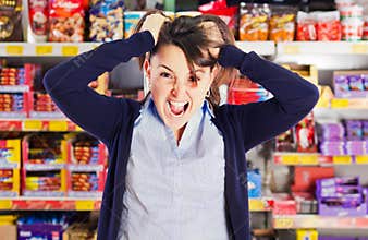 Attractive woman yelling or screaming in grocery s