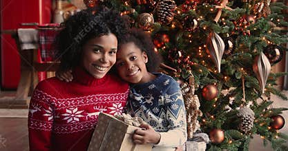 Happy african american family enjoying Christmas time together.