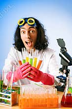 Chemist in the lab experimenting