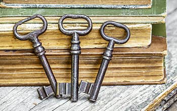 Escape room game, old vintage keys and books