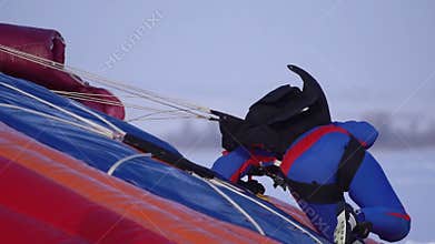 Acurate skydiver with parachute landed on the target on trampoline closeup view.
