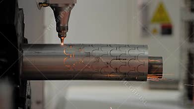 Laser cutting machine working with metal workpiece with sparks: side view
