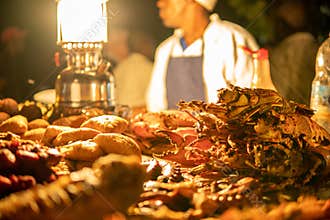 Zanzibari night street food market in Forodhani Gardens. Stone Town, Zanzibar City, Unguja island, Tanzania