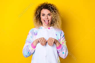 Portrait of attractive cheerful foolish childish wavy-haired girl in pajama pretending like dog isolated over vivid