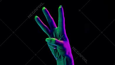 Female hand showing 3 with fingers isolated on black background. One, two, three numbers gesture, reade set go, math