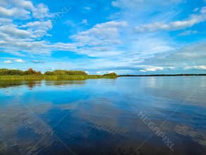 Panorama from a canal Kükhernster Feart between Leeuwarden and Groningen in Friesland, The Netherlands